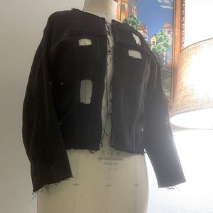 Black Jean jacket with stylized square cuts, stylized neck, sleeves, & bottom.